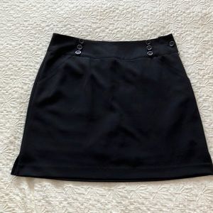 EP Pro black skirt with attached shorts. Button detail on waistband & side zip
